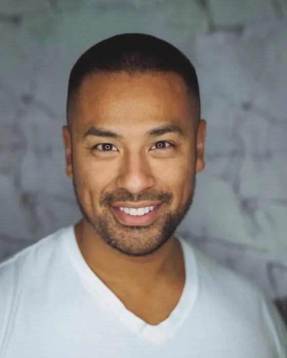 The same man with an AI-preview buzz cut, one short length all over