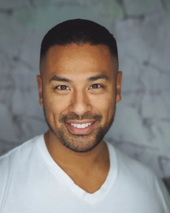 The same man with an AI-preview high fade, short top and sides fading high on the head